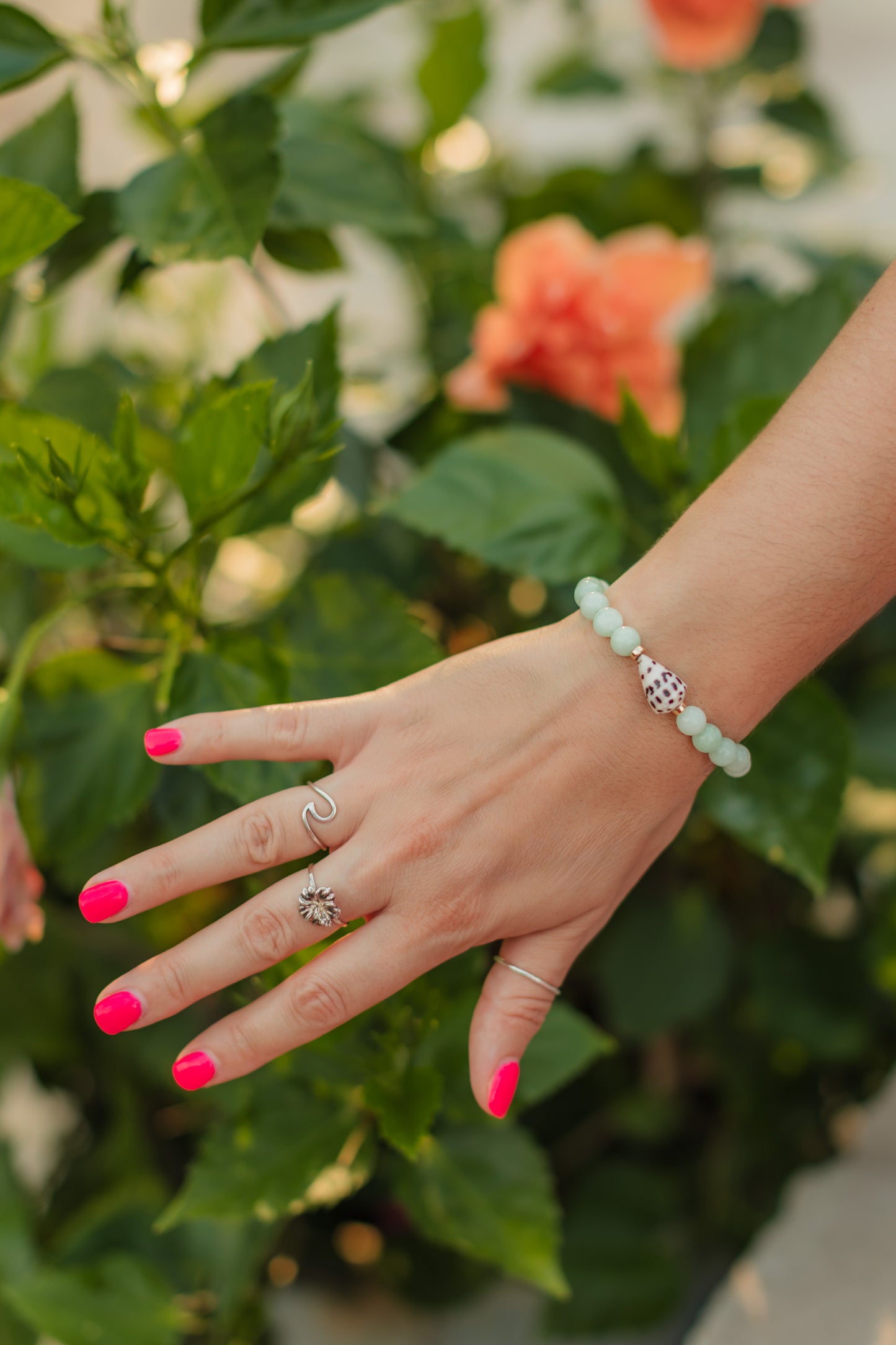 Seafoam Cove Bracelet featuring genuine seafoam green quartz gemstones, 14K gold-filled accent beads, and a rare natural Hebrew cone shell centerpiece inspired by hidden tropical coves and ocean treasures.