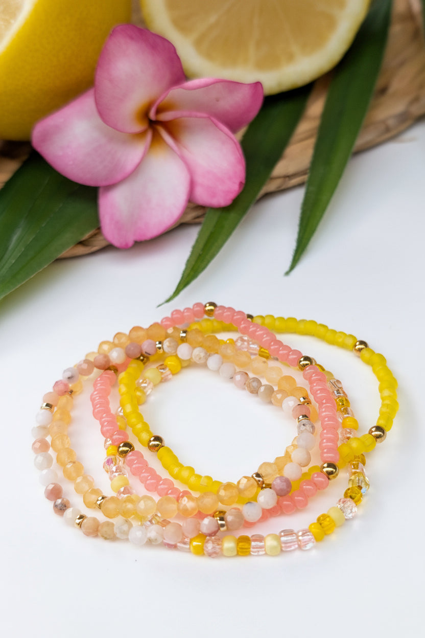 Summer bracelet stack with pink and yellow beads and 14K gold filled accents