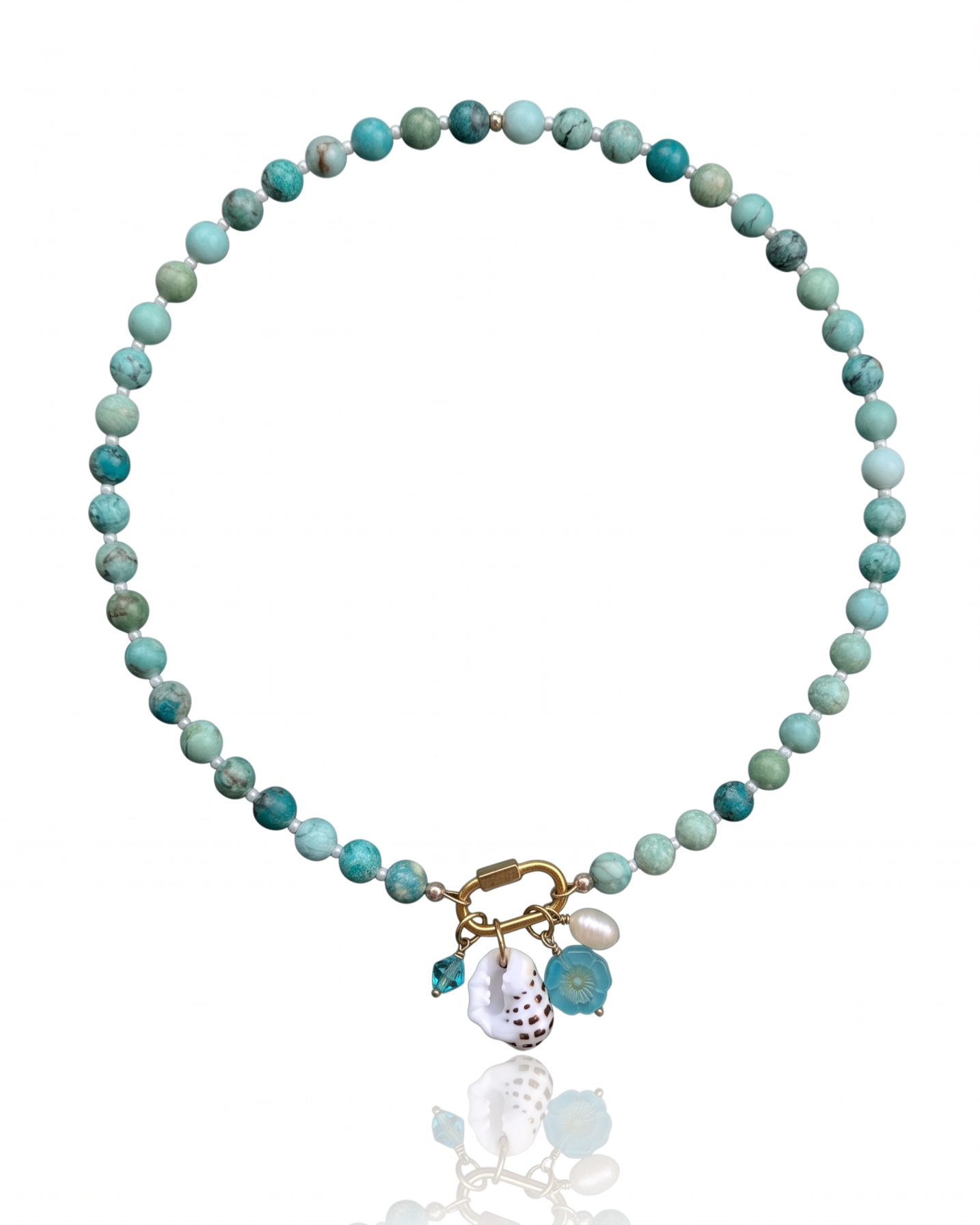 Island Treasure Necklace with Peruvian turquoise gemstones, an 18K gold PVD carabiner clasp, and four removable coastal charms