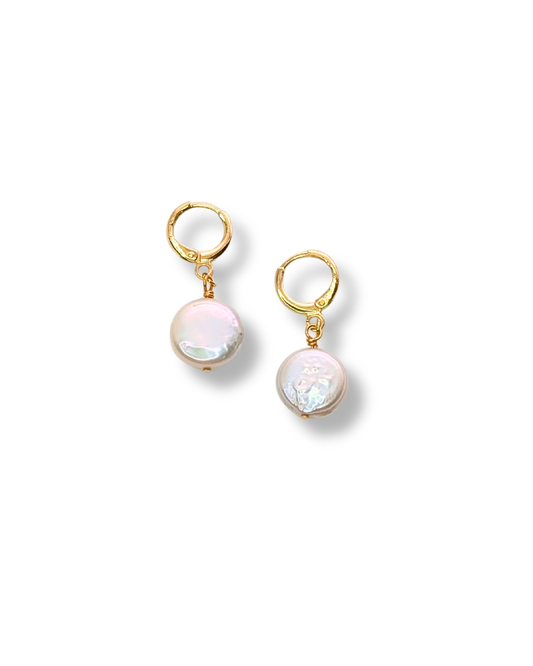 “Serene Pearl Huggies – coin pearl earrings with 18k gold-plated huggies.”