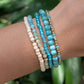 Azure Sands coastal bracelet stack worn on the wrist featuring amazonite gemstones, turquoise beads, and gold-filled accents.