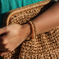 Golden Light Bracelet layered with other gold chains – Charlotte’s Cove Island Dreams Collection.