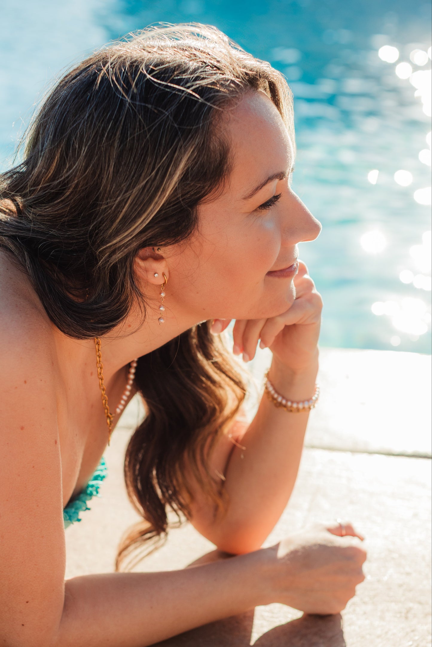 Island Dreams Earrings worn – soft pink pearl drop earrings from Charlotte’s Cove.