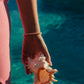 Island Dreams Bracelet layered with gold jewelry – Charlotte’s Cove Island Dreams Collection.