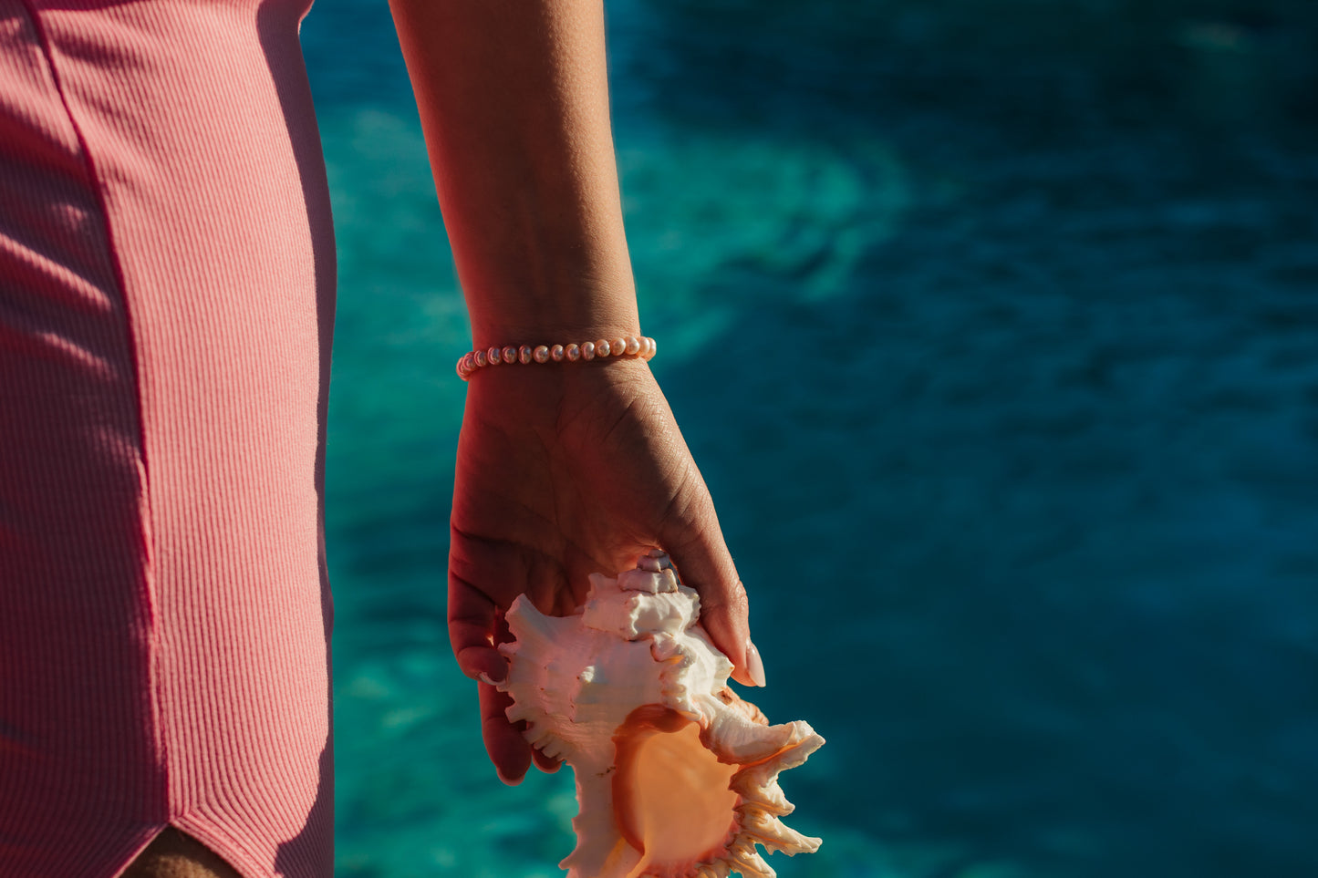 Island Dreams Bracelet layered with gold jewelry – Charlotte’s Cove Island Dreams Collection.