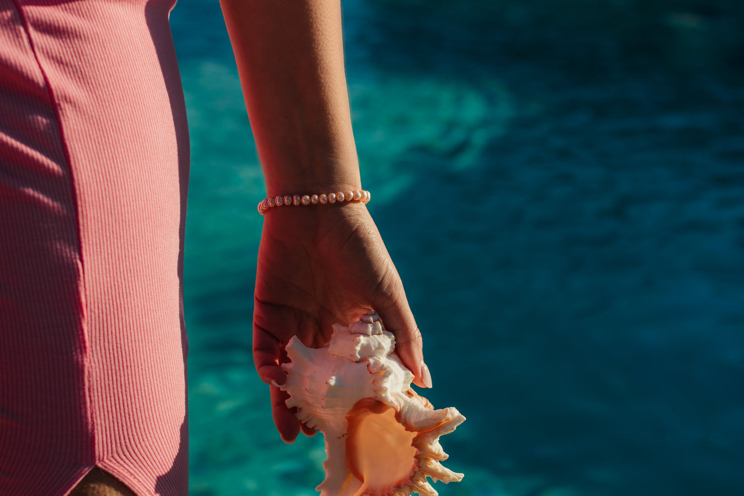 Island Dreams Bracelet layered with gold jewelry – Charlotte’s Cove Island Dreams Collection.