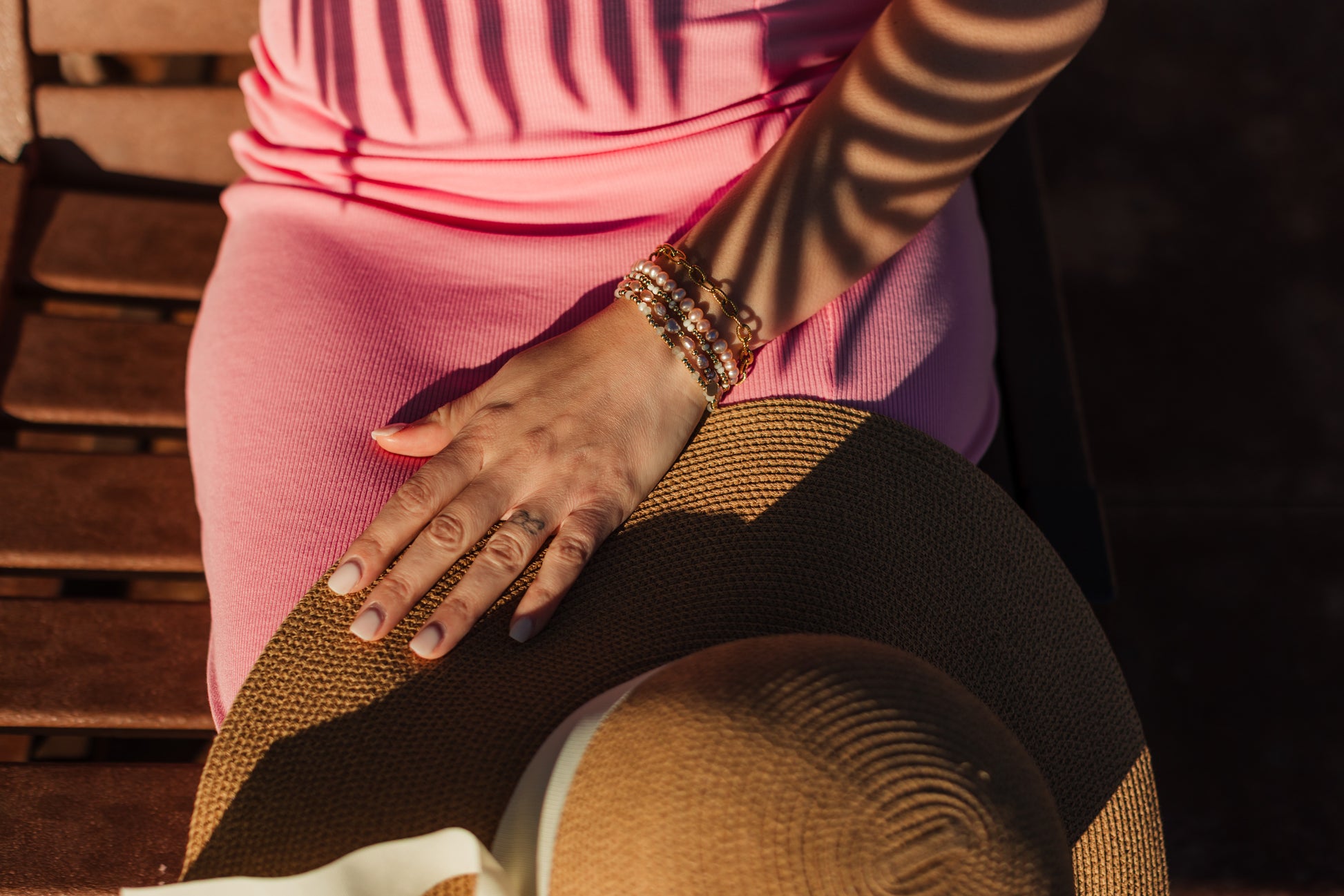 Golden Light Bracelet layered with other gold chains – Charlotte’s Cove Island Dreams Collection.