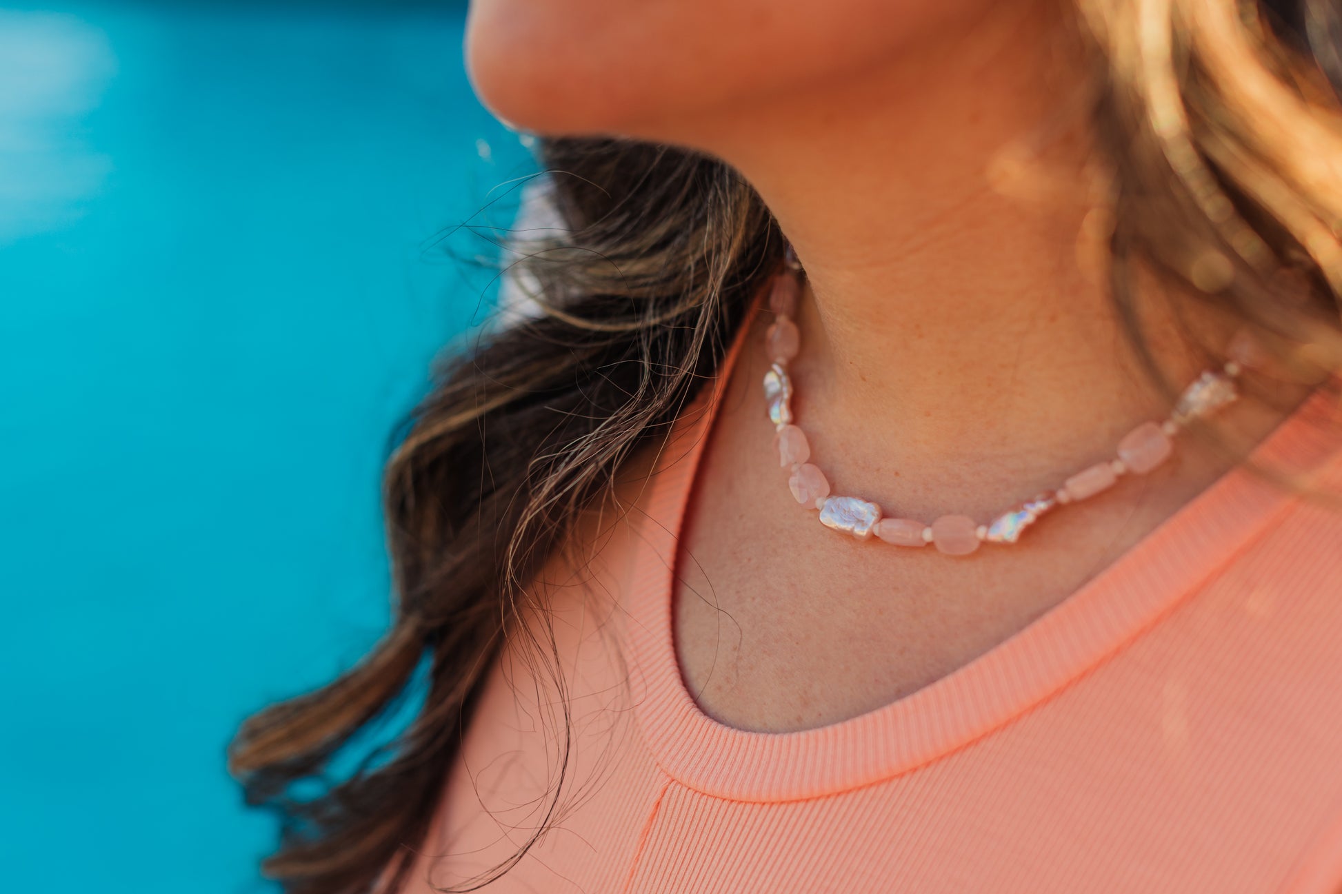 Pink Skies Necklace layered with gold chains – Charlotte’s Cove Island Dreams Collection.