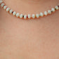 Hand-strung necklace featuring genuine mother of pearl rondelles, faceted watermelon tourmaline gemstones, and 18K Gold PVD hardware inspired by tropical coastal style.
