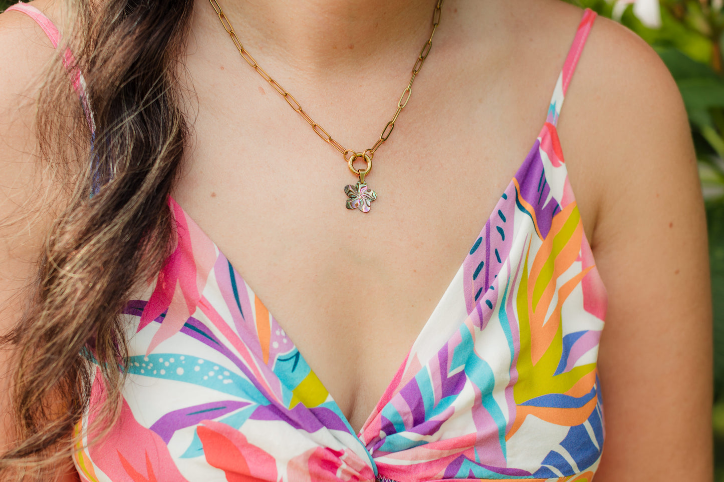 Hand-carved genuine abalone shell flower pendant necklace on an 18K Gold PVD paperclip chain with a removable carabiner clasp.