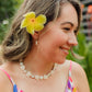 Handwoven freshwater pearl floral necklace featuring assorted genuine pearls arranged in a Hawaiian lei-inspired design with 18K Gold PVD hardware.