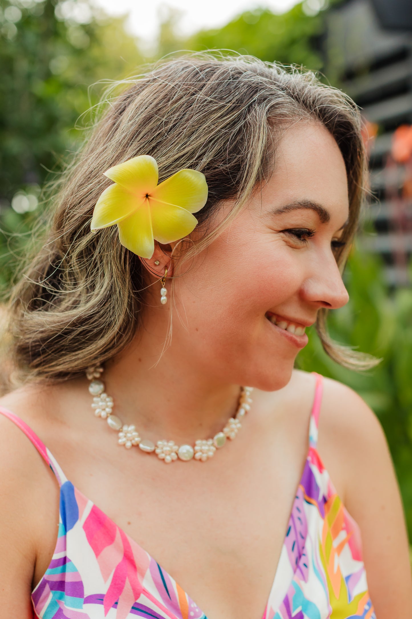 Handwoven freshwater pearl floral necklace featuring assorted genuine pearls arranged in a Hawaiian lei-inspired design with 18K Gold PVD hardware.