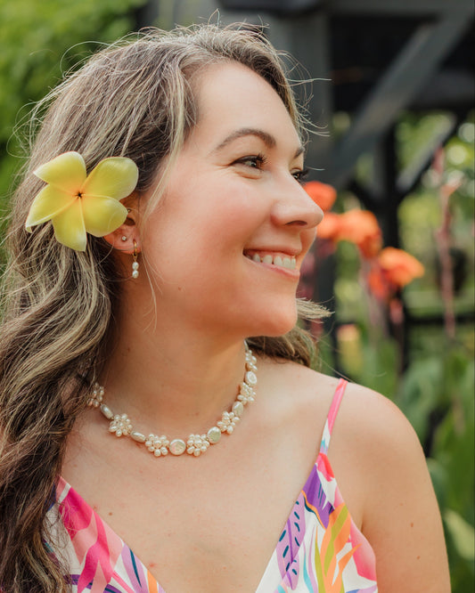 Leilani freshwater pearl floral necklace styled with coordinating pearl jewelry for an elegant island-inspired look