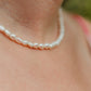 Hand-strung freshwater potato pearl choker necklace featuring genuine 6 mm pearls with 18K Gold PVD hardware, designed for effortless layering and timeless coastal style.