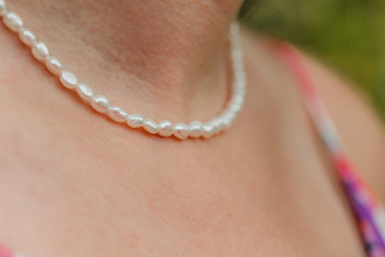 Hand-strung freshwater potato pearl choker necklace featuring genuine 6 mm pearls with 18K Gold PVD hardware, designed for effortless layering and timeless coastal style.
