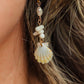 Sunrise Shell Coral Drop Earrings featuring genuine Hawaiian sunrise shells, natural coral chips, freshwater pearls, and 18K Gold PVD hoops inspired by the rare treasures of Hawaii.