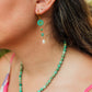 Turquoise Hibiscus Pearl Drop Earrings featuring handcrafted Czech glass hibiscus flowers, turquoise Swarovski crystals, faceted turquoise gemstone beads, freshwater pearl drops, and 18K Gold PVD hoops.