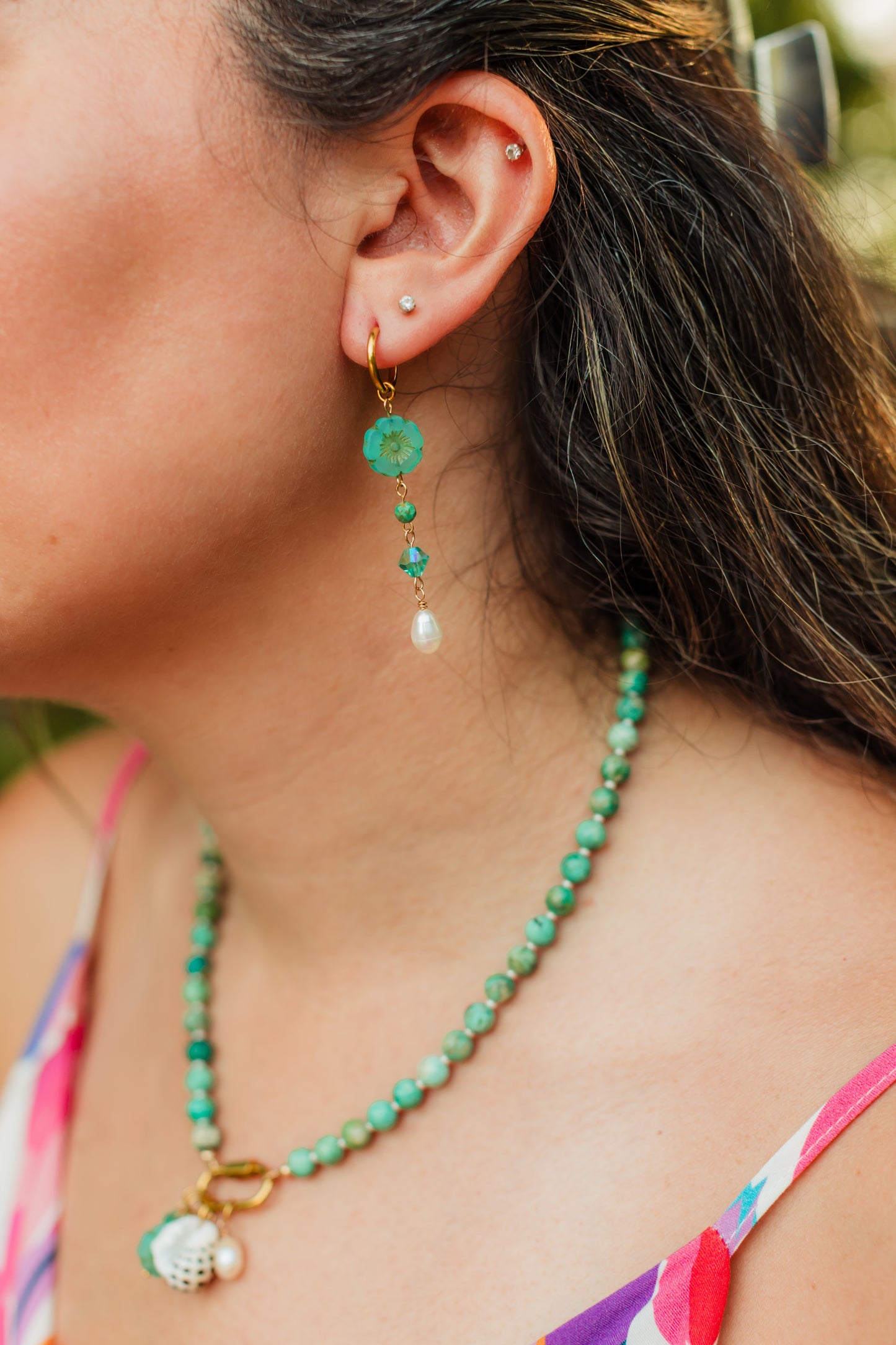 Turquoise Hibiscus Pearl Drop Earrings featuring handcrafted Czech glass hibiscus flowers, turquoise Swarovski crystals, faceted turquoise gemstone beads, freshwater pearl drops, and 18K Gold PVD hoops.