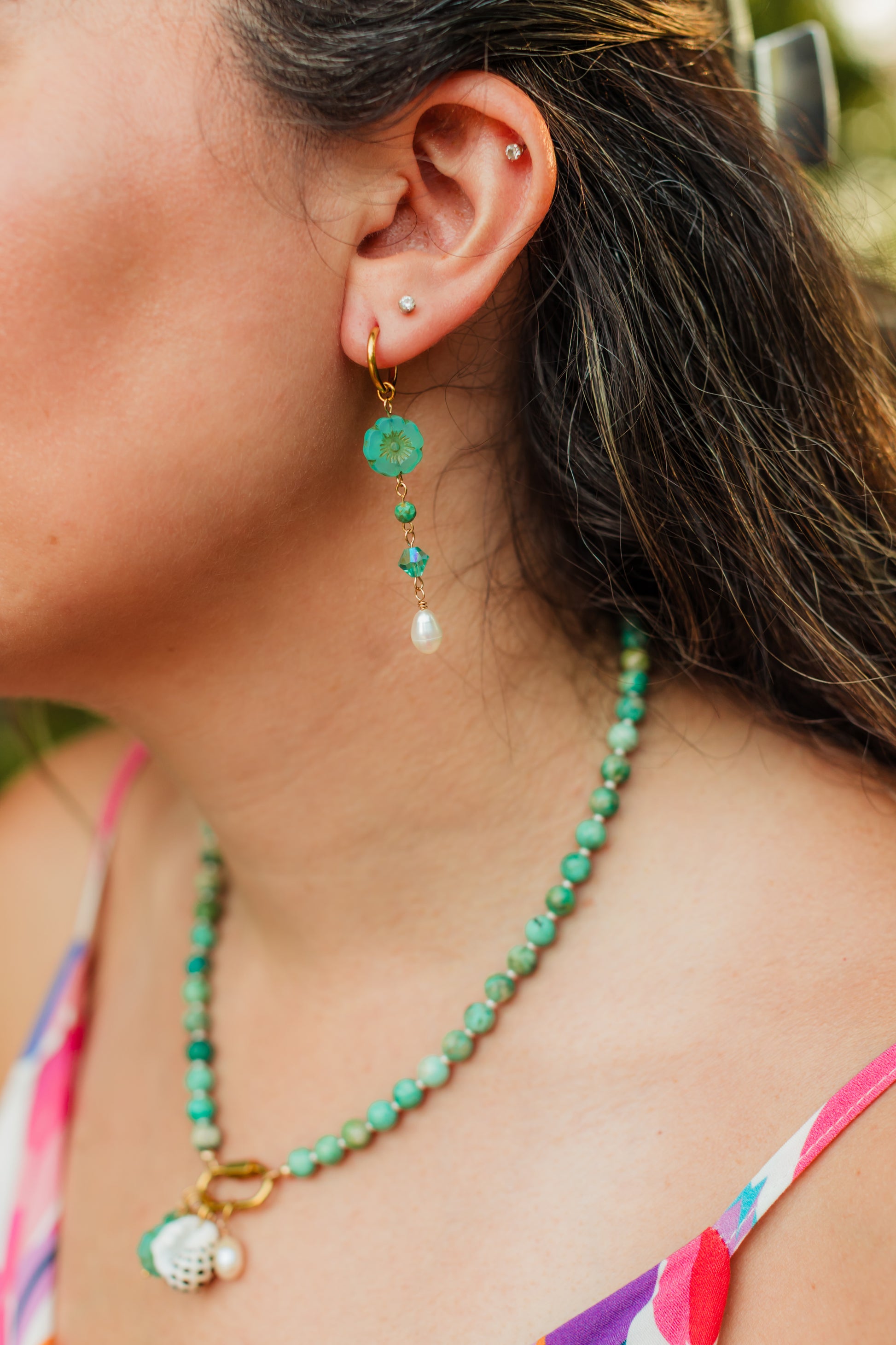 Turquoise Hibiscus Pearl Drop Earrings featuring handcrafted Czech glass hibiscus flowers, turquoise Swarovski crystals, faceted turquoise gemstone beads, freshwater pearl drops, and 18K Gold PVD hoops.