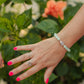Seafoam Cove Bracelet featuring genuine seafoam green quartz gemstones, 14K gold-filled accent beads, and a rare natural Hebrew cone shell centerpiece inspired by hidden tropical coves and ocean treasures.
