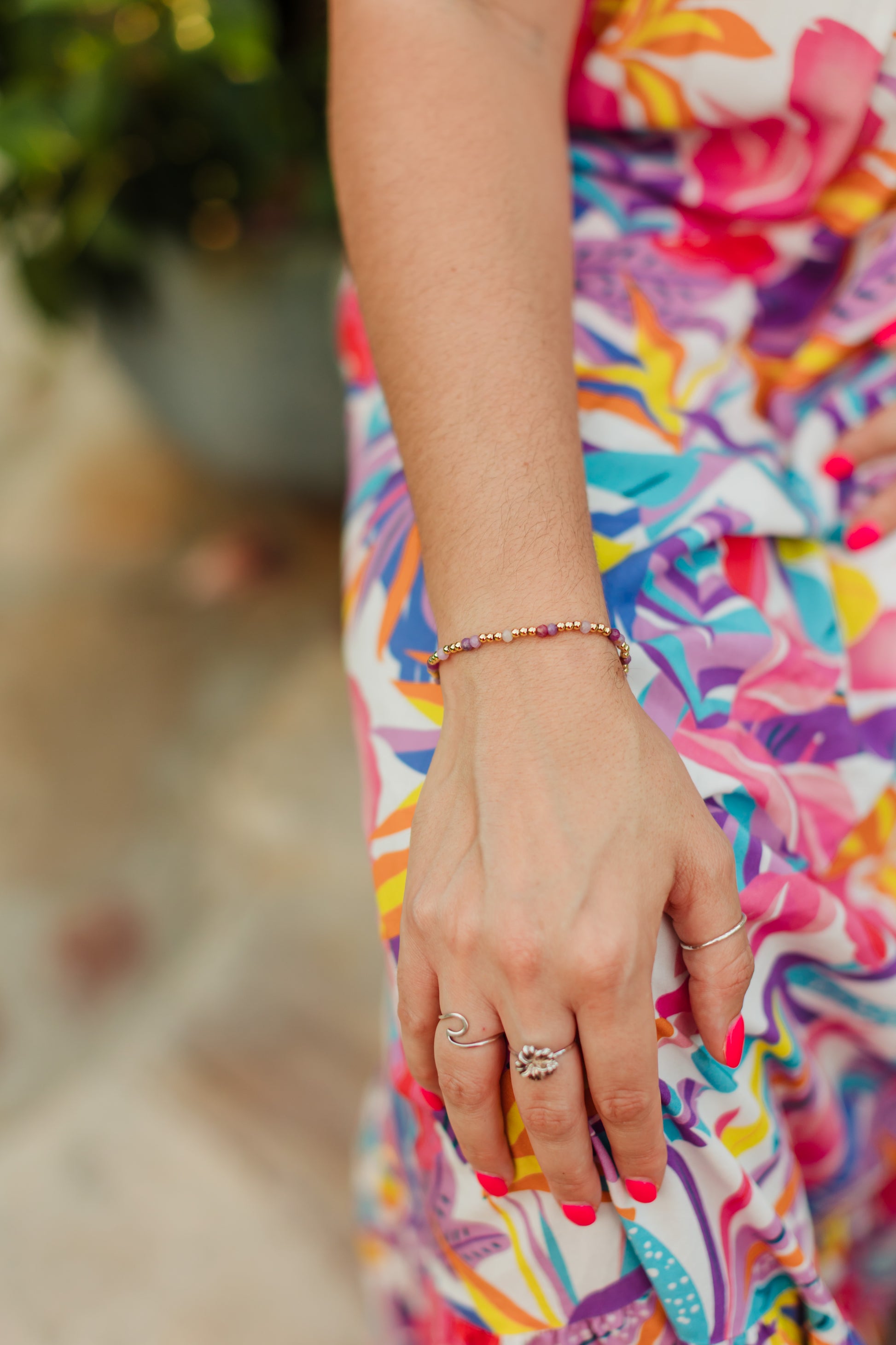 Pink Ruby Hibiscus Bracelet featuring genuine faceted pink ruby gemstones and polished gold-filled spacer beads inspired by tropical pink and purple sunsets.