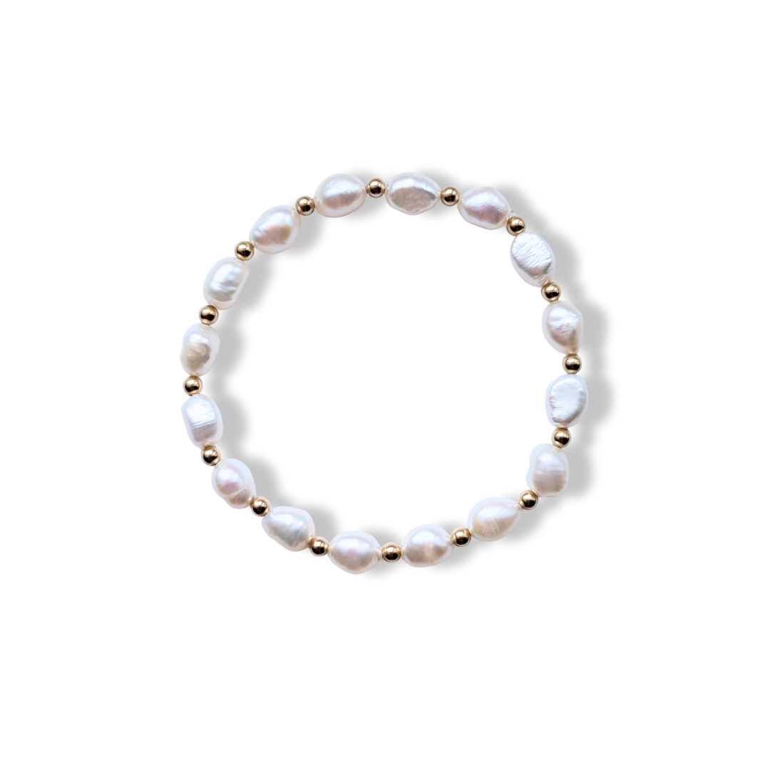 Pearl bracelet with gold accents on a white background from Charlotte's Cove