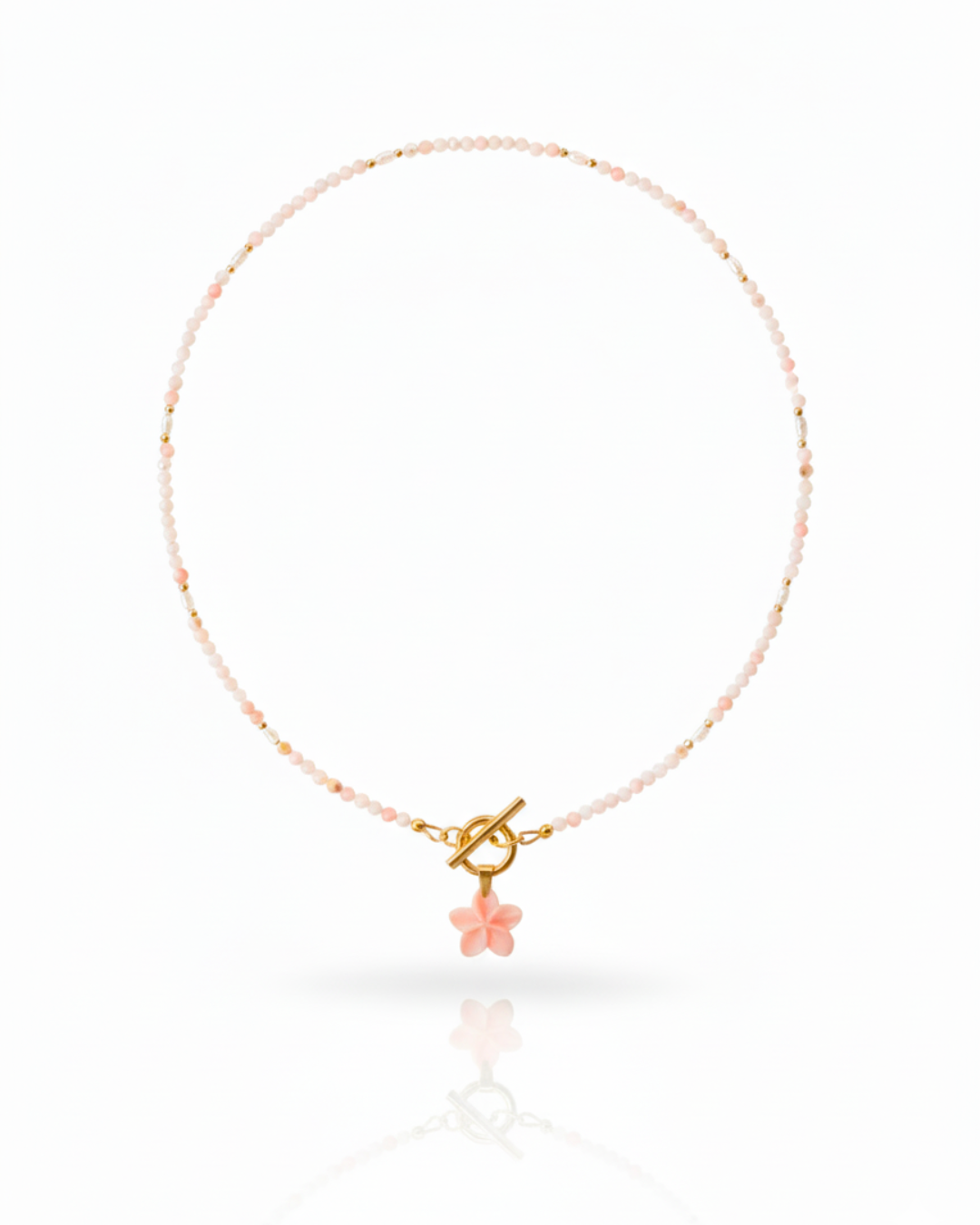 Island Blush Necklace with pink conch plumeria, freshwater pearls, and pink opal beads.