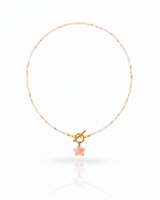 Island Blush Necklace with pink conch plumeria, freshwater pearls, and pink opal beads.