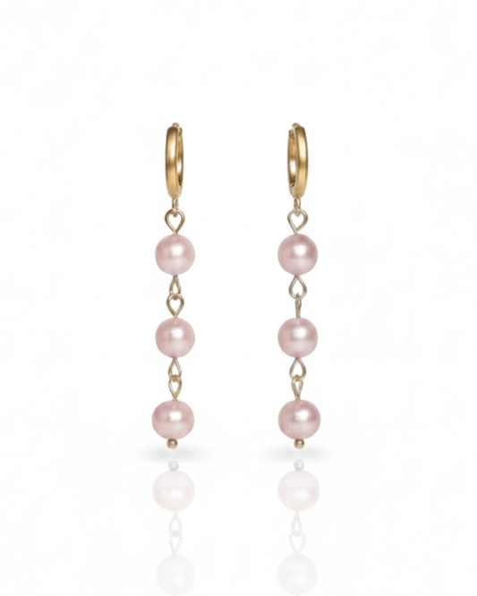 Island Dreams Earrings with blush pink seed pearl drops on gold huggie hoops.