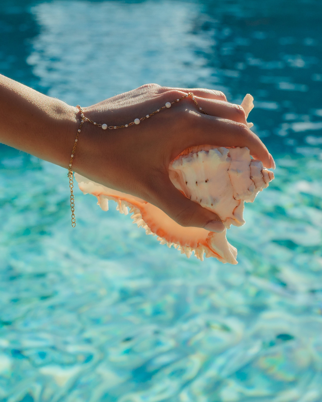 Horizon Hand Chain worn on hand – minimalist coastal hand jewelry from Charlotte’s Cove.