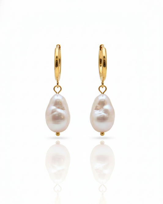 Rosé Resort Earrings with soft pink baroque pearls on gold huggie hoops.