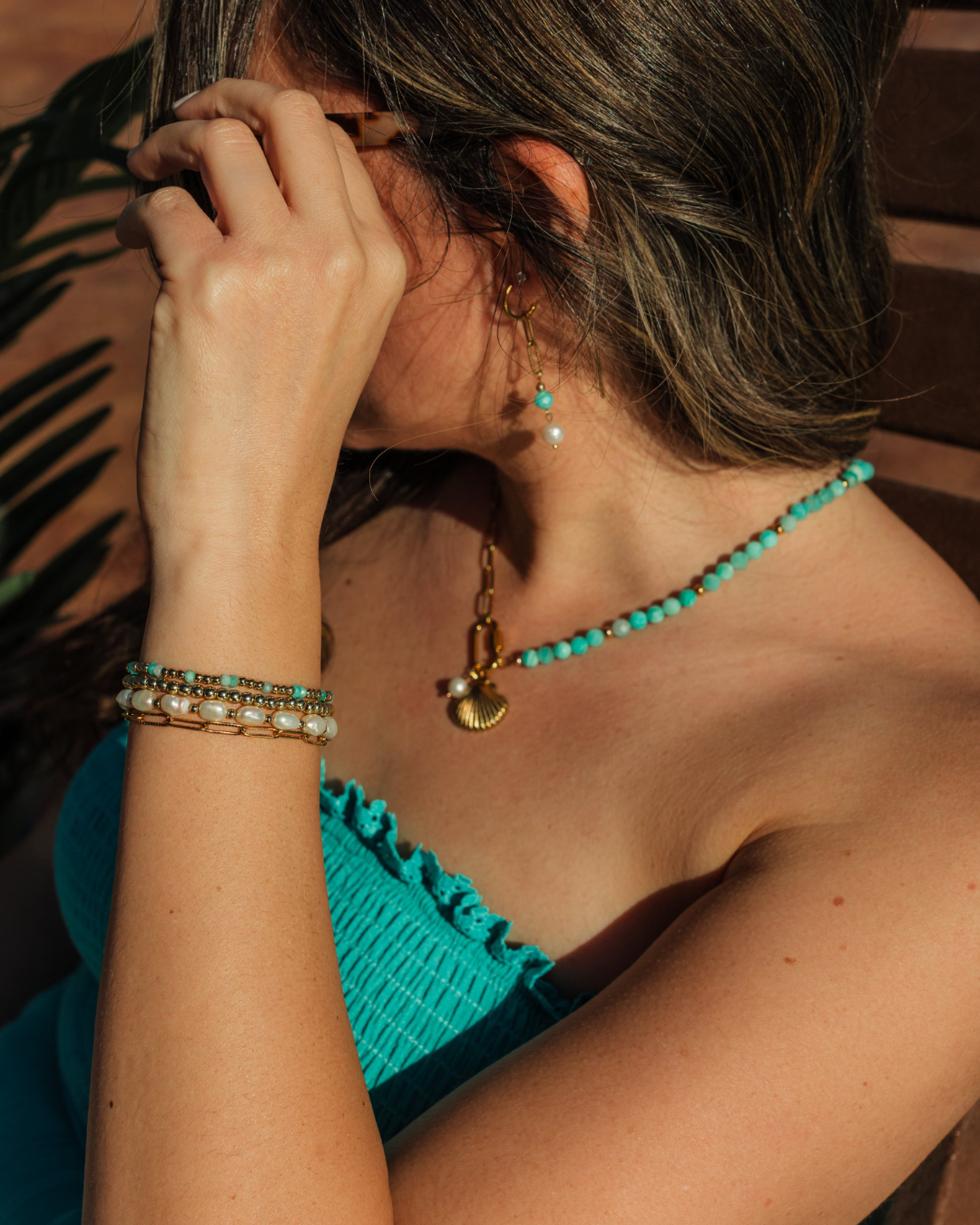 Marina Earrings worn for seaside dinners – coastal gold huggie earrings from Charlotte’s Cove.