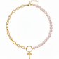 Island Dreams Necklace with gold palm tree charm, blush seed pearls, and oval cable chain.