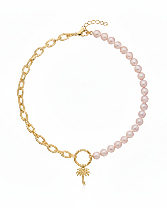 Island Dreams Necklace with gold palm tree charm, blush seed pearls, and oval cable chain.