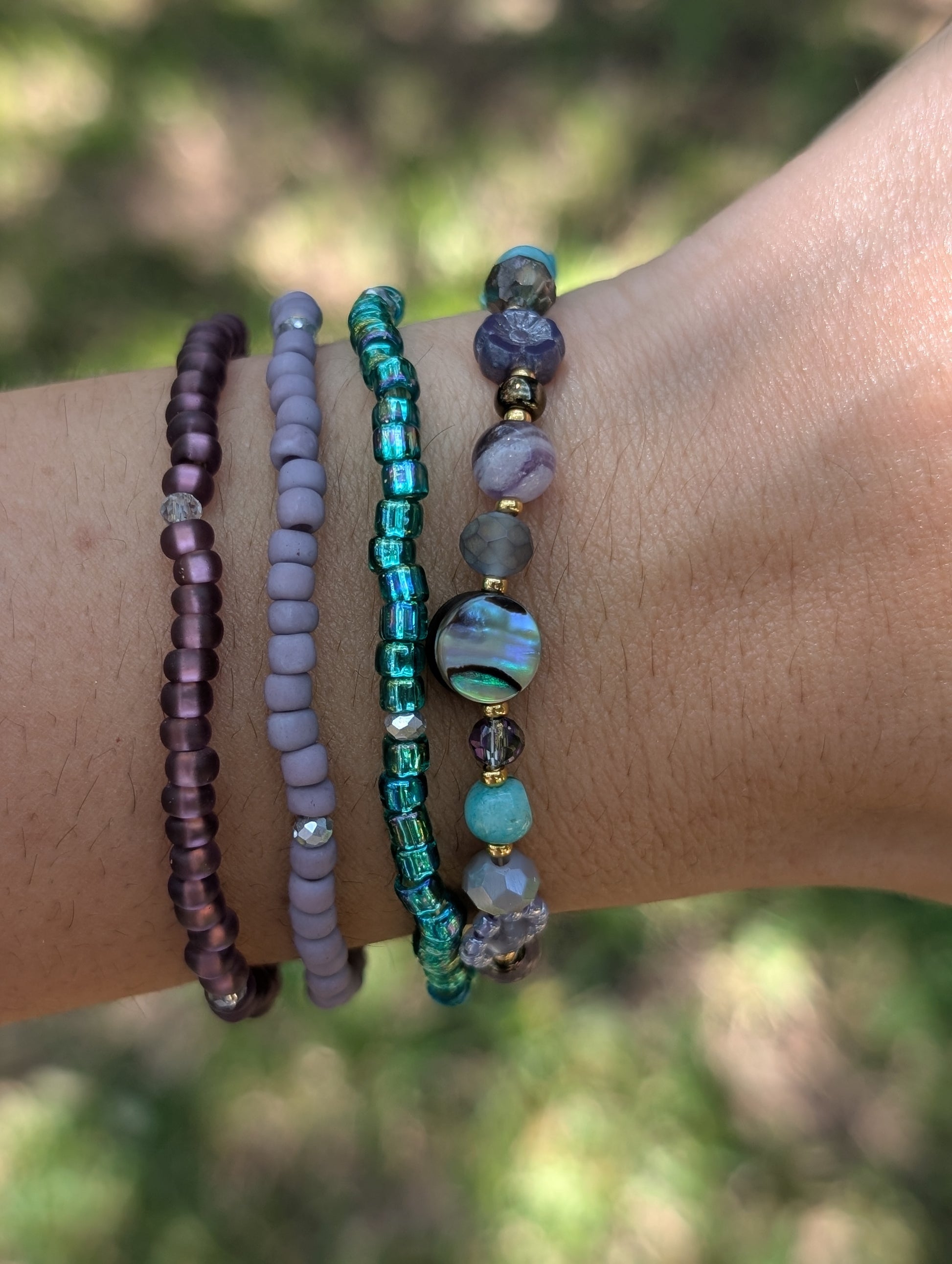 “Mermaid For More bracelet stacked with other Sparkle Stacklers – Cappa Creations fall collection.”