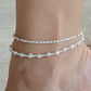 Close-up of mixed 3mm and 6mm freshwater pearl anklet with gold hardware