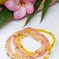 Summer bracelet stack with pink and yellow beads and 14K gold filled accents