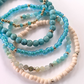 Azure Sands bracelet stack featuring amazonite gemstones, turquoise beads, cream seed beads, and 14K gold-filled accents.