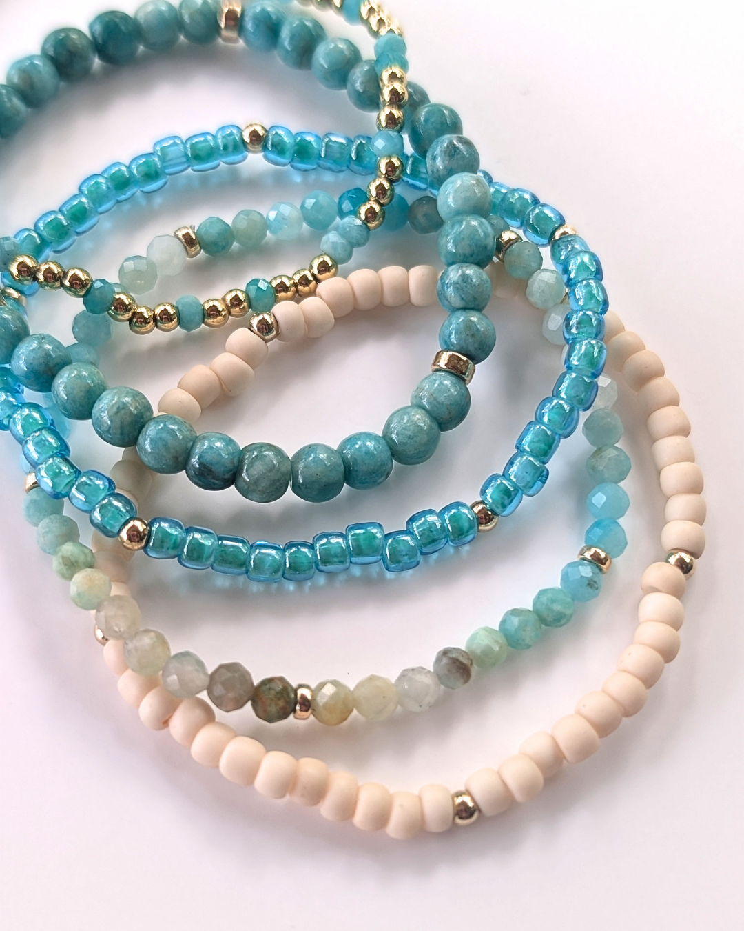 Azure Sands bracelet stack featuring amazonite gemstones, turquoise beads, cream seed beads, and 14K gold-filled accents.