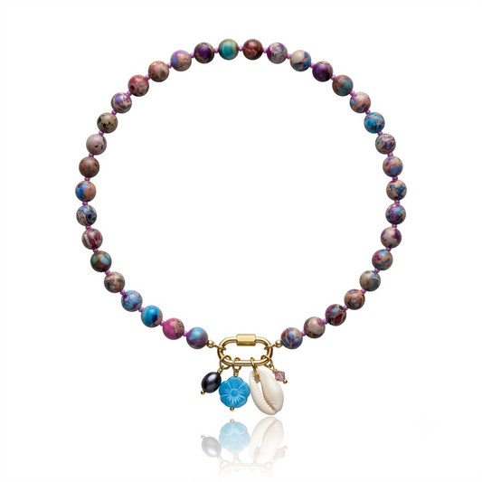 Hand-strung sea sediment jasper gemstone necklace featuring marbled berry, turquoise, and sandy neutral tones with a gold carabiner clasp and removable coastal-inspired charms.