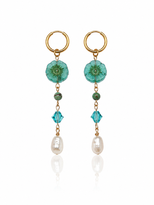 Turquoise Hibiscus Pearl Drop Earrings featuring handcrafted Czech glass hibiscus flowers, turquoise Swarovski crystals, faceted turquoise gemstone beads, freshwater pearl drops, and 18K Gold PVD hoops.