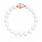Lavender Bloom Bracelet featuring genuine polished white shell beads, a rare natural lavender cone shell centerpiece, and 14K gold-filled accent beads inspired by Hawaii's hidden beach treasures.