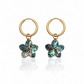 Pair of gold hoop earrings with abalone shell flower charms on a white background