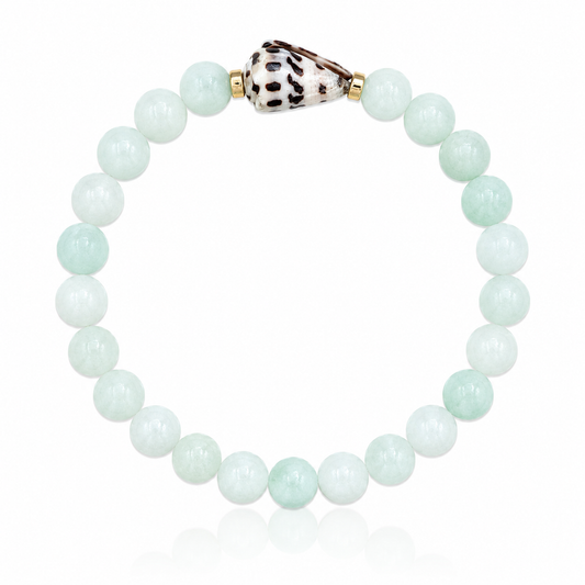 Seafoam Cove Bracelet featuring genuine seafoam green quartz gemstones, 14K gold-filled accent beads, and a rare natural Hebrew cone shell centerpiece inspired by hidden tropical coves and ocean treasures.