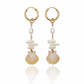 Sunrise Shell Coral Drop Earrings featuring genuine Hawaiian sunrise shells, natural coral chips, freshwater pearls, and 18K Gold PVD hoops inspired by the rare treasures of Hawaii.
