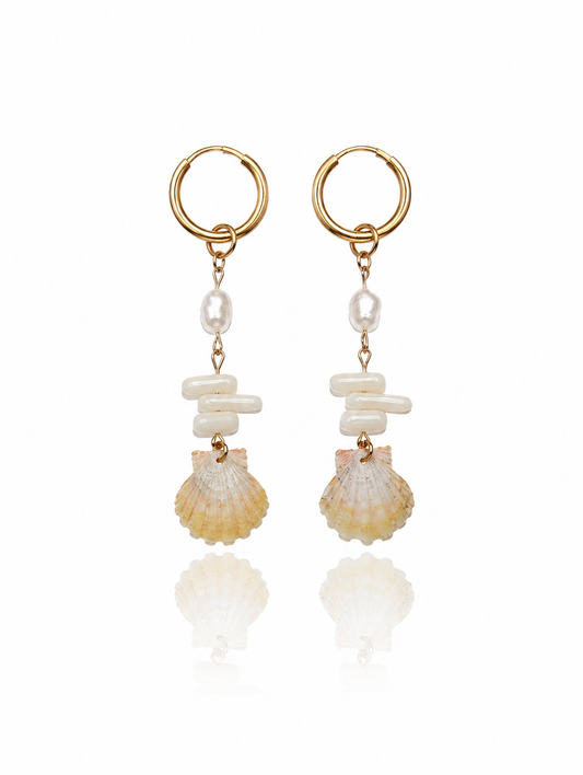 Sunrise Shell Coral Drop Earrings featuring genuine Hawaiian sunrise shells, natural coral chips, freshwater pearls, and 18K Gold PVD hoops inspired by the rare treasures of Hawaii.
