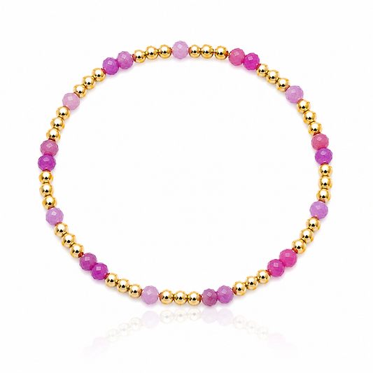 Pink Ruby Hibiscus Bracelet featuring genuine faceted pink ruby gemstones and polished gold-filled spacer beads inspired by tropical pink and purple sunsets.